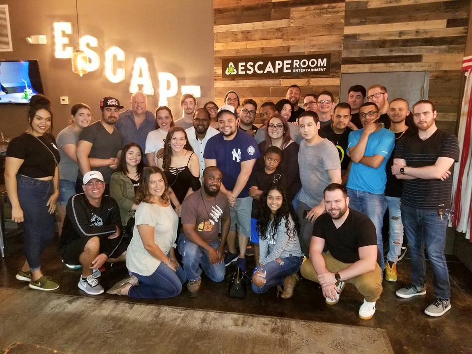 A large group of about forty guests filling the lobby at The Escape Company Orlando